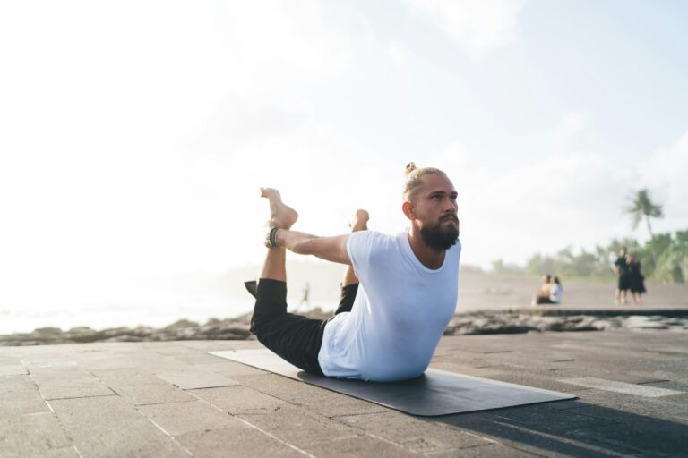 caucasian-man-enjoying-hatha-practice-for-enlightenment-harmony-and-mindfulness-768x512